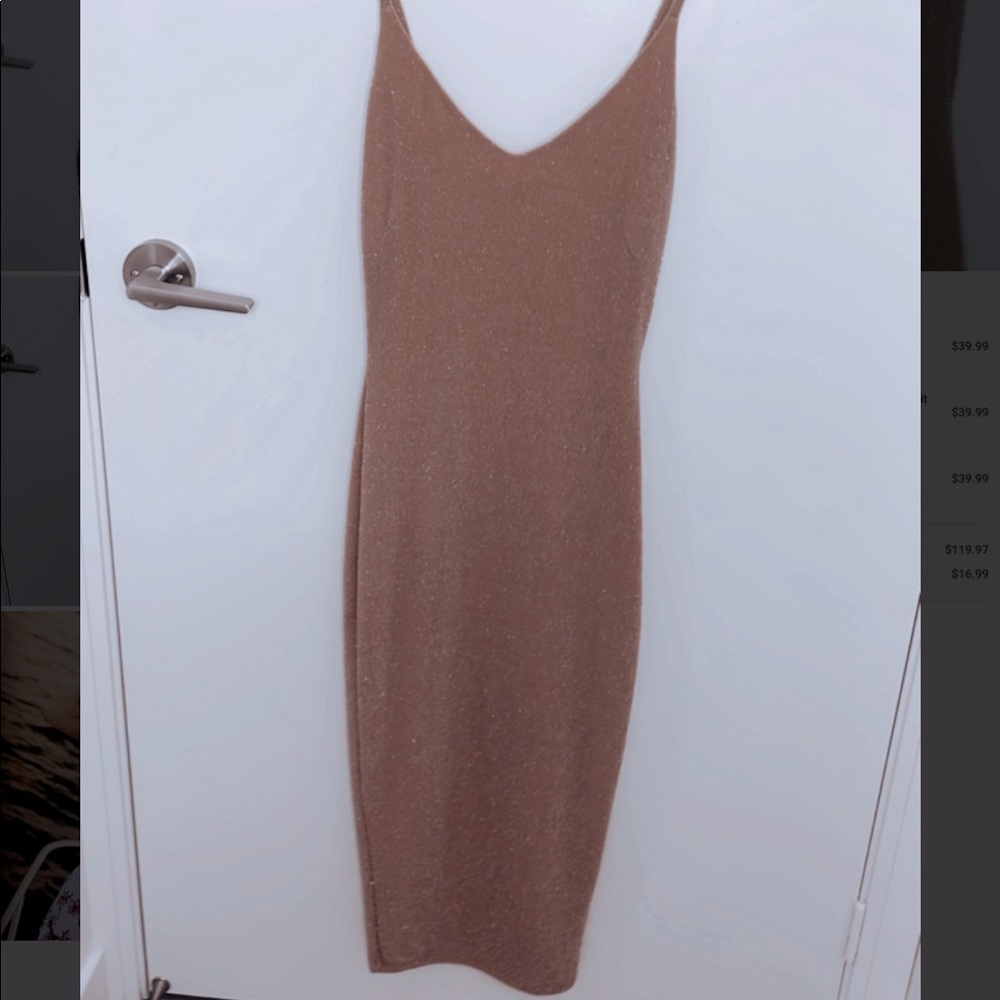 Beautiful beige/tanned color with a silver sparkle. It has a nice slinky to it.